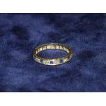 A SAPPHIRE AND DIAMOND ETERNITY RING, MISSING ONE STONE