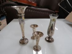 A COLLECTION OF HALLMARKED SILVER AND WHITE METAL VASES ETC. (5)