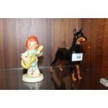 A ROYAL DOULTON CH.RANCHO DOBE'S STORM DOBERMANN FIGURE TOGETHER WITH A GOEBEL SWINGER FIGURE (3)