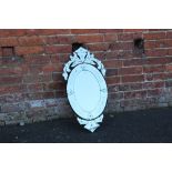 A FLORAL OVAL WALL MIRROR OVERALL SIZE - 77CM X 39CM