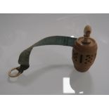 AN ANTIQUE CARVED TAPE MEASURE WITH INTEGRAL STANHOPE - SOUVENIR OF BOURNEMOUTH FANCY FAIR