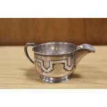 A HALLMARKED SILVER DECORATIVE MILK JUG BY WALKER AND HALL