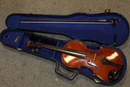 A CASED METROPOLE TWO PIECE BACK VIOLIN AND BOW - MADE IN SAXONY