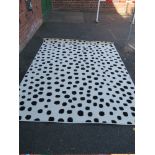 A LARGE MODERN SPOTTY RUG 285 X 200 cm