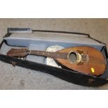 A CASED VINTAGE MANDOLIN WITH INLAID DETAIL