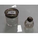 A HALLMARKED SILVER TOPPED VANITY JAR TOGETHER WITH A SILVER TOPPED SCENT BOTTLE, BOTH WITH DENTS