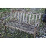 A WOODEN GARDEN BENCH