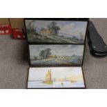 A PAIR OF FRAMED AND GLAZED WATERCOLOURS OF LANDSCAPES WITH CATTLE INDISTINCTLY SIGNED MCKINLEY?