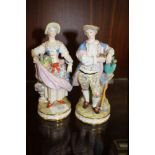 A PAIR OF DRESDEN STYLE FIGURES WITH BLUE CROSS SWORDS BACK STAMP - ONE WITH BROKEN HAND