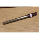 A VINTAGE LEATHER COATED BRASS BRITANIC TELESCOPE