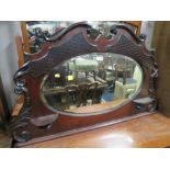 AN EDWARDIAN EBONISED SHAPED OVERMANTEL MIRROR H 68 CM,. w 110 cm