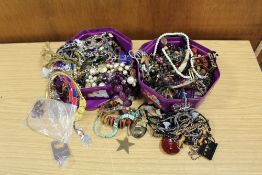 TWO TUBS OF ASSORTED COSTUME JEWELLERY