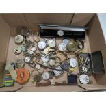 A BOX OF WRIST AND POCKET WATCH PARTS TO INCLUDE A LADIES OMEGA DE VILLE WRIST WATCH A/F