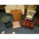 A SMALL THREE DRAWER CHEST, TWO STOOLS, A CHILDS CHAIR & A CANTERBURY (5)