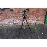 AN ANTIQUE BRASS SURVEYORS LEVEL ON TRIPOD