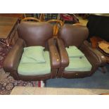 A PAIR OF LEATHER EFFECT CLUB TYPE ARMCHAIRS