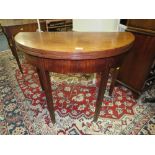 AN ANTIQUE MAHOGANY DEMI-LUNE FOLDOVER TEA TABLE, W 94 cm