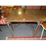A MODERN INDUSTRIAL STYLE METAL TOPPED TABLE ON CASTORS, H 76 cm, W 80 cm