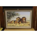 A LARGE GILT FRAMED OIL ON BOARD DEPICTING LIONS RESTING BESIDE A TREE BY DENNIS HUTCHINSON
