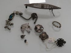 A BAG OF SILVER AND WHITE METAL BROOCHES, FILIGREE MODEL BOAT ETC.