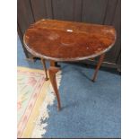 A VINTAGE WALNUT DROPLEAF TABLE ON SLENDER CABRIOLE LEGS