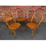 A SET OF FOUR ERCOL HOOP BACK DINING CHAIRS TOGETHER WITH A SIMILAR ARMCHAIR (5)