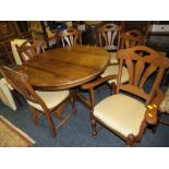 AN OAK EXTENDING DINING TABLE WITH SIX CHAIRS (4 + 2)