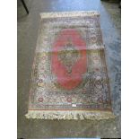 A SMALL VINTAGE WOOLLEN RUG 91 X134 cm