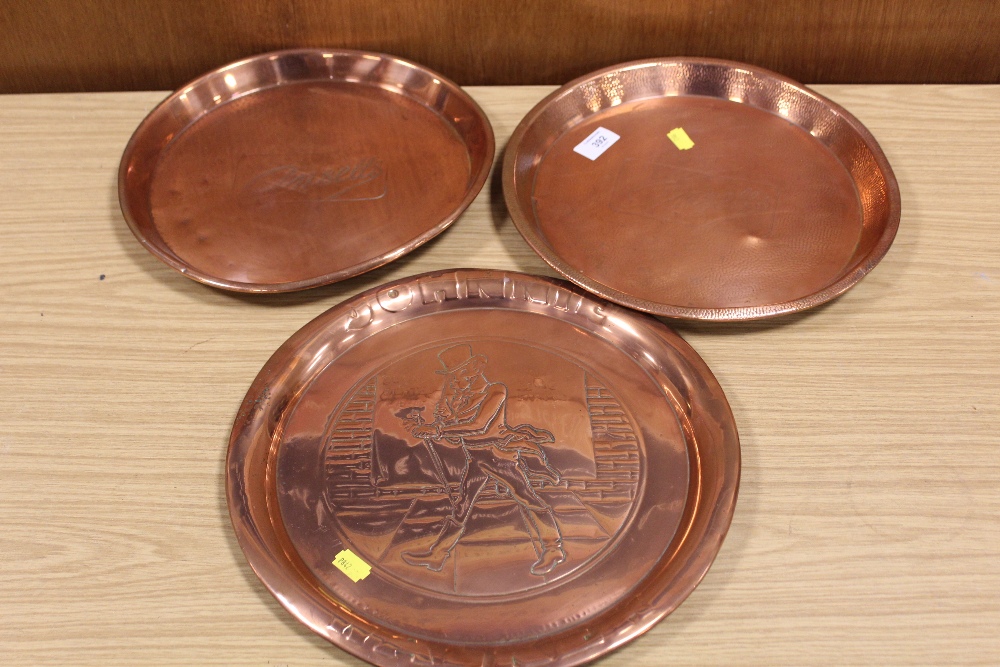 A VINTAGE COPPER JOHNNY WALKER WHISKEY TRAY TOGETHER WITH TWO ANSELLS EXAMPLES (3)