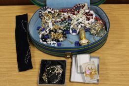 A CASE OF ASSORTED COSTUME JEWELLERY