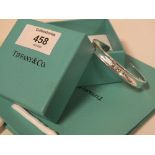 A TIFFANY STYLE BANGLE WITH BOX AND BAG