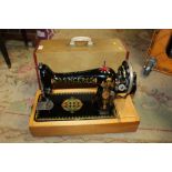 A CASED VINTAGE SINGER Y1467249 SEWING MACHINE