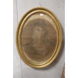 AN ANTIQUE PENCIL PORTRAIT STUDY OF A LADY HOLDING AND POINTING TO A SCROLL IN GILT OVAL FRAME