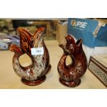 TWO CORNISH GLAZED POTTERY FISH GLUG JUGS