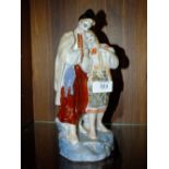 A RUSSIAN CERAMIC FIGURE OF A MAN AND WOMAN, H 27 CM