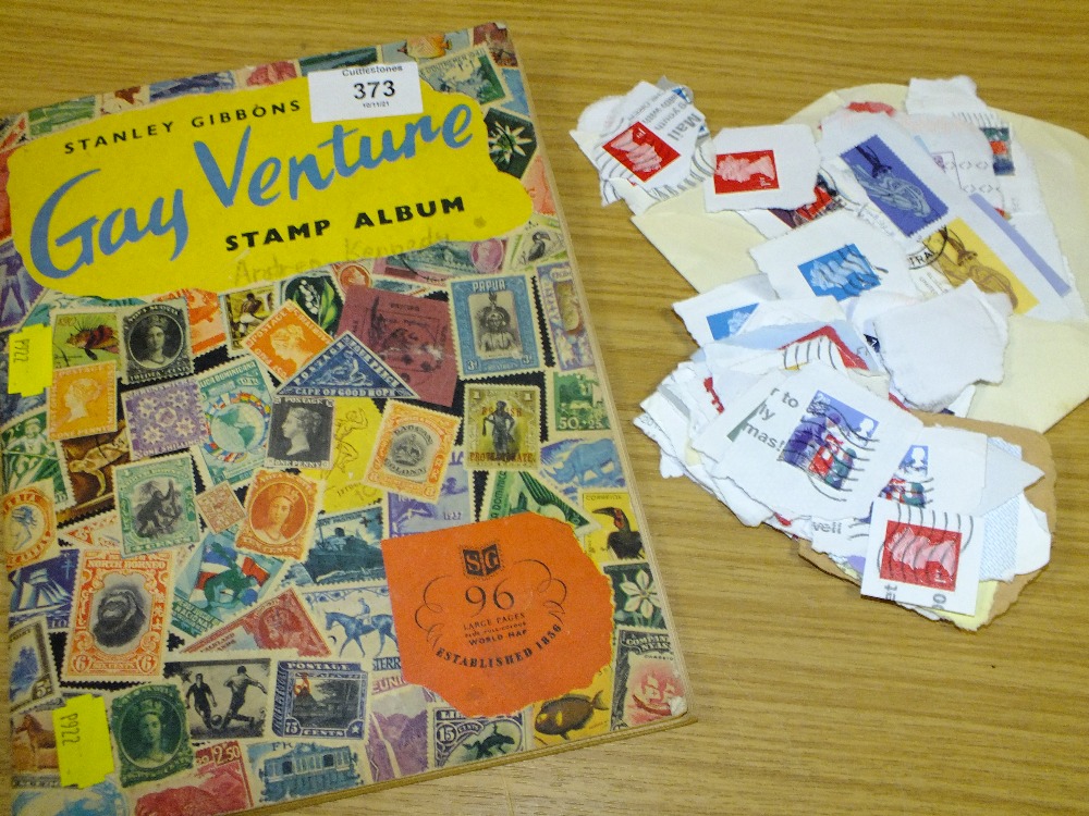 A VINTAGE STAMP ALBUM AND CONTENTS