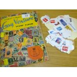 A VINTAGE STAMP ALBUM AND CONTENTS