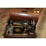 A CASED VINTAGE SINGER EA545988 SEWING MACHINE