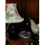 A VINTAGE ANGLE POISE DESK LAMP WITH SHELL SHAPED SHADE, TOGETHER WITH A VINTAGE GLASS BOTTLE