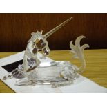 A SWAROVSKI CRYSTAL FIGURE OF A UNICORN WITH CERTIFICATE