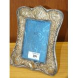 A HALLMARKED SILVER EASEL BACK PICTURE FRAME, REBATE SIZE 13.8 X 9.7 CM