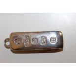 A LARGE HALLMARKED SILVER INGOT, APPROX WEIGHT 59 G