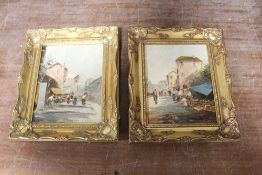 A PAIR OF GILT FRAMED CONTINENTAL OIL ON CANVAS STREET SCENES WITH FIGURES INDISTINCTLY SIGNED