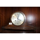 A VINTAGE OAK CASED NAPOLEON HAT MANTEL CLOCK