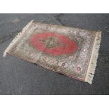 A SMALL VINTAGE WOOLLEN RUG 91 X134 cm