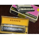 A CASED HOHNER 64 CHROMONICA TOGETHER WITH A BOXED STYLOPHONE