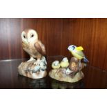 A ROYAL CROWN DERBY MATT FINISH OWL FIGURE TOGETHER WITH A ROYAL CROWN DERBY BLUE TIT AND CHICKS