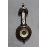 AN ANTIQUE CARVED OAK WALL BAROMETER, H 48 CM