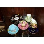 A COLLECTION OF AYNSLEY CUPS AND SAUCERS ETC. TO INCLUDE TWO CUPS AND SAUCERS WITH FLORAL INTERIORS,