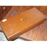 A SMALL LEATHER CARRY CASE INITIALLED N.J. WITH LINED INTERIOR